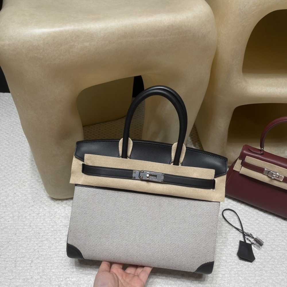 30cm Birkin (Fabric & Swift Leather) – Color: 89 Noir (with Silver Hardware) The fabric material creates a youthful vibe and is lighter than full-leather versions, which is its key feature.