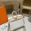 Hermès Birkin 25 (Triomphe H Canvas & Swift Leather) – Color: I2/Nata (with Silver Hardware) – A soft cream-white hue – This model is characterized by a combination of high-quality Swift leather and lightweight canvas. The natural cream-white color create