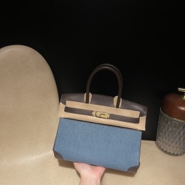 30cm Birkin (Swift Leather & Denim Canvas) – Color: 46/Ebene with Gold Hardware The perfect combination of Swift leather and canvas creates a profound vintage mood – a rare item with excellent investment potential.