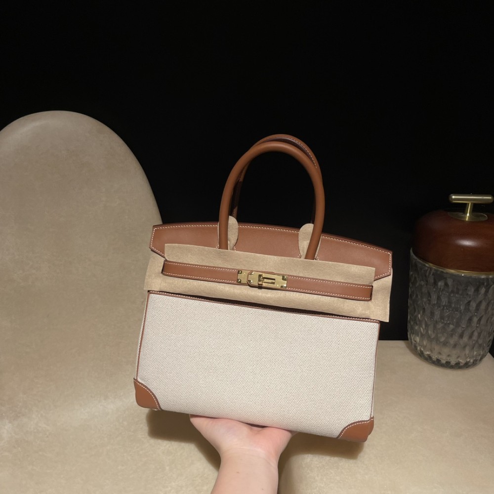 Hermès Birkin 30 (Swift Leather & Canvas) – Color: 37/Gold with Gold Hardware The attractive fusion of Swift leather and canvas creates an elegant vintage style – a rare model with great collector value.