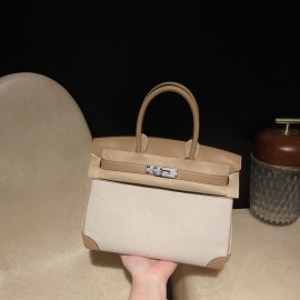 Hermès Birkin 30 (Canvas & Swift Leather) – Color: 0M/Chai with Gold Hardware The casualness of the canvas and the soft texture of Swift leather are charming – lighter and easier to use than full-leather models, fitting for a youthful style.
