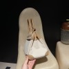 Hermès Birkin 30 (Canvas & Swift Leather) – Color: 0M/Chai with Gold Hardware The casualness of the canvas and the soft texture of Swift leather are charming – lighter and easier to use than full-leather models, fitting for a youthful style.