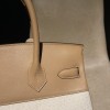 Hermès Birkin 30 (Canvas & Swift Leather) – Color: 0M/Chai with Gold Hardware The casualness of the canvas and the soft texture of Swift leather are charming – lighter and easier to use than full-leather models, fitting for a youthful style.